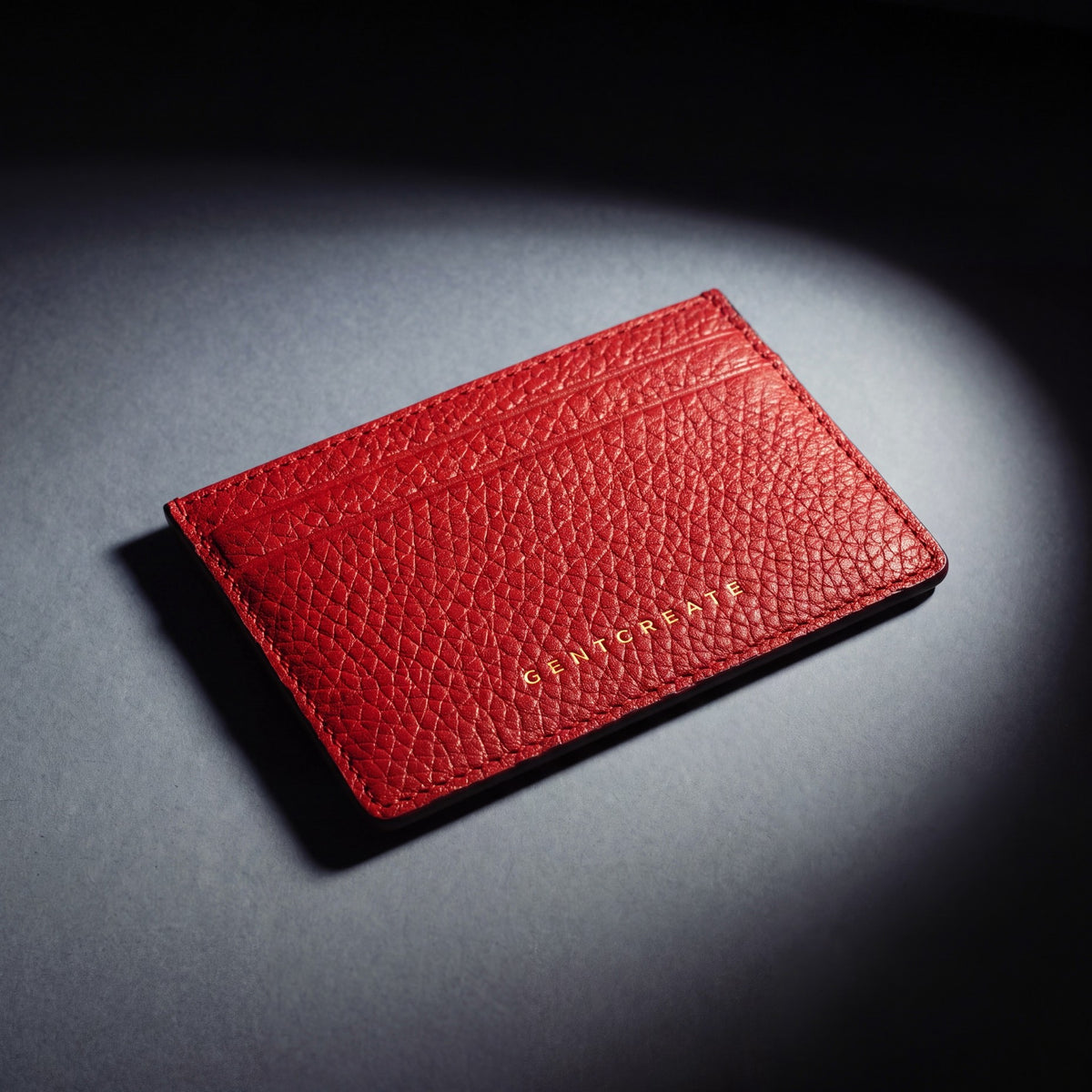 Close-up of the leather grain of a red pebble leather card holder by GENTCREATE
