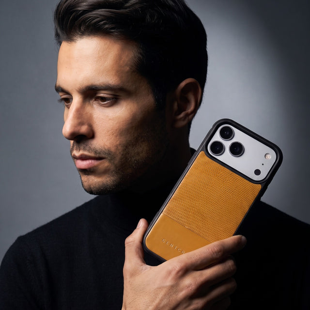 Man holding a yellow lizard-embossed leather iPhone 18 Pro Max case by GENTCREATE beside his face