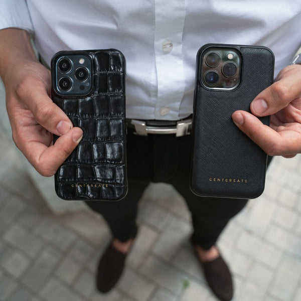 A man holding two luxury iPhone cases by Gentcreate luxury fashion brand