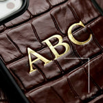 Custom personalized initials leather iPhone case in crocodile pattern in burgundy color by GENTCREATE close-up