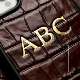 Custom personalized initials leather iPhone case in crocodile pattern in burgundy color by GENTCREATE close-up