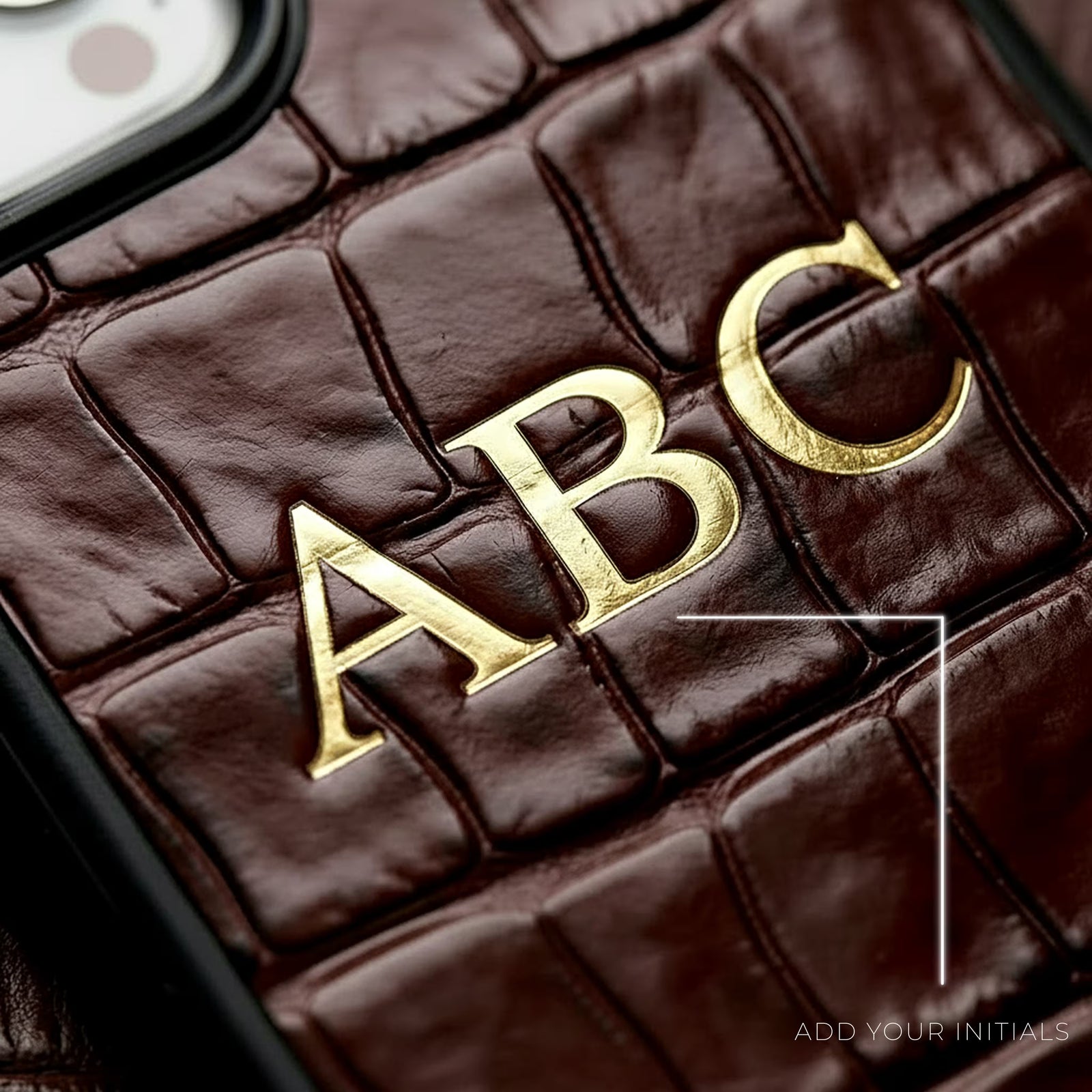 Custom personalized initials leather iPhone case in crocodile pattern in burgundy color by GENTCREATE close-up