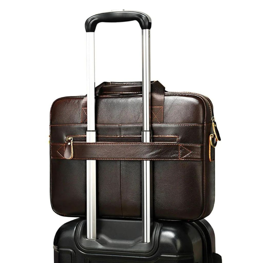 Luxury leather bag from the brand Gentcreate attached to carry-on luggage.