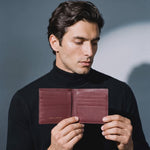 Man opening a burgundy crocodile-embossed leather bifold wallet by GENTCREATE to show the card slots, video