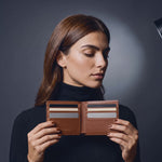 Woman opening a brown crocodile-embossed leather bifold wallet by GENTCREATE to show the card slots, video
